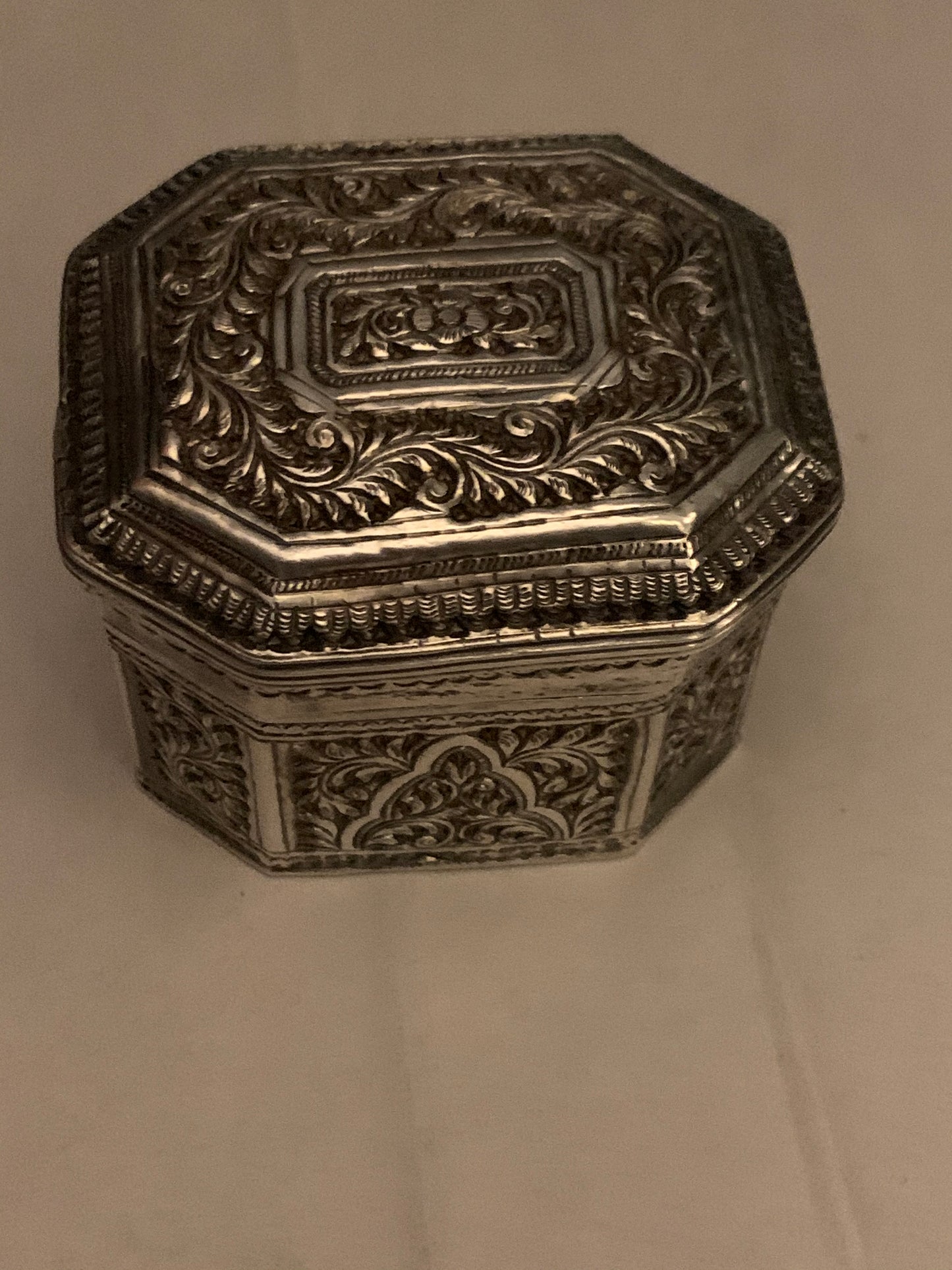 An octagonal silver box