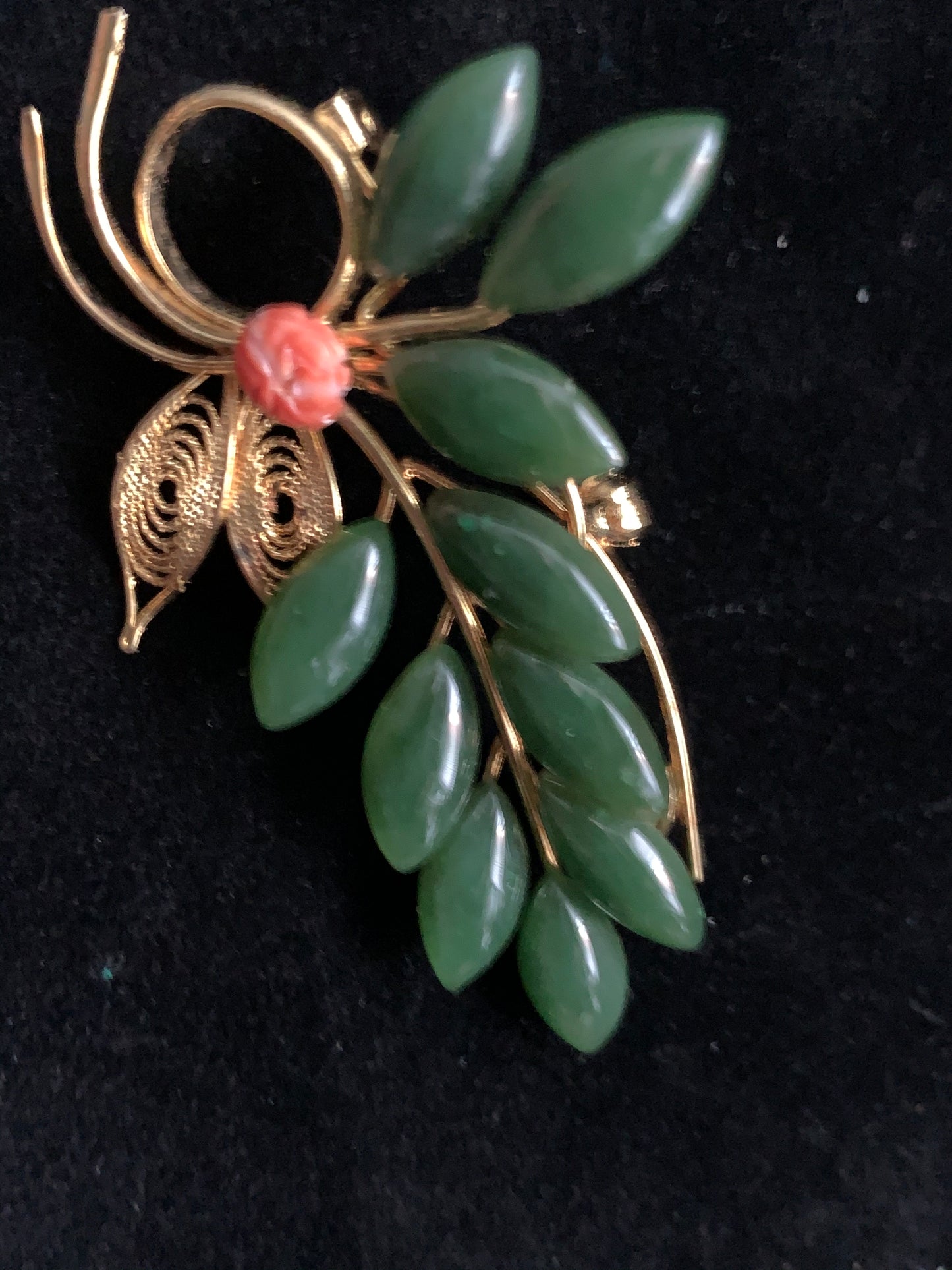 A jade and coral brooch