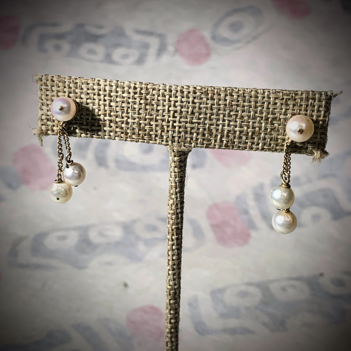 A pair of pearl and gold earrings