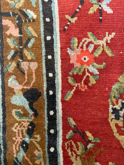An antique Tibetan wool rug