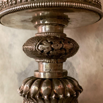 An antique Tibetan silver butterlamp