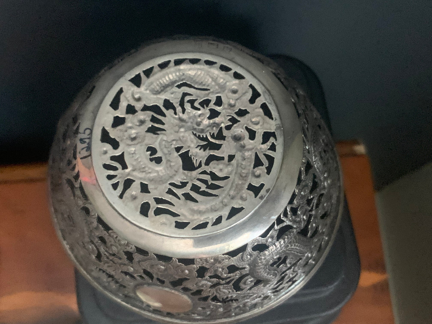 A silver bowl sleeve
