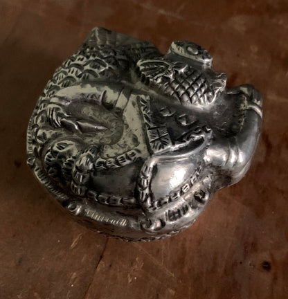 A silver pill box
