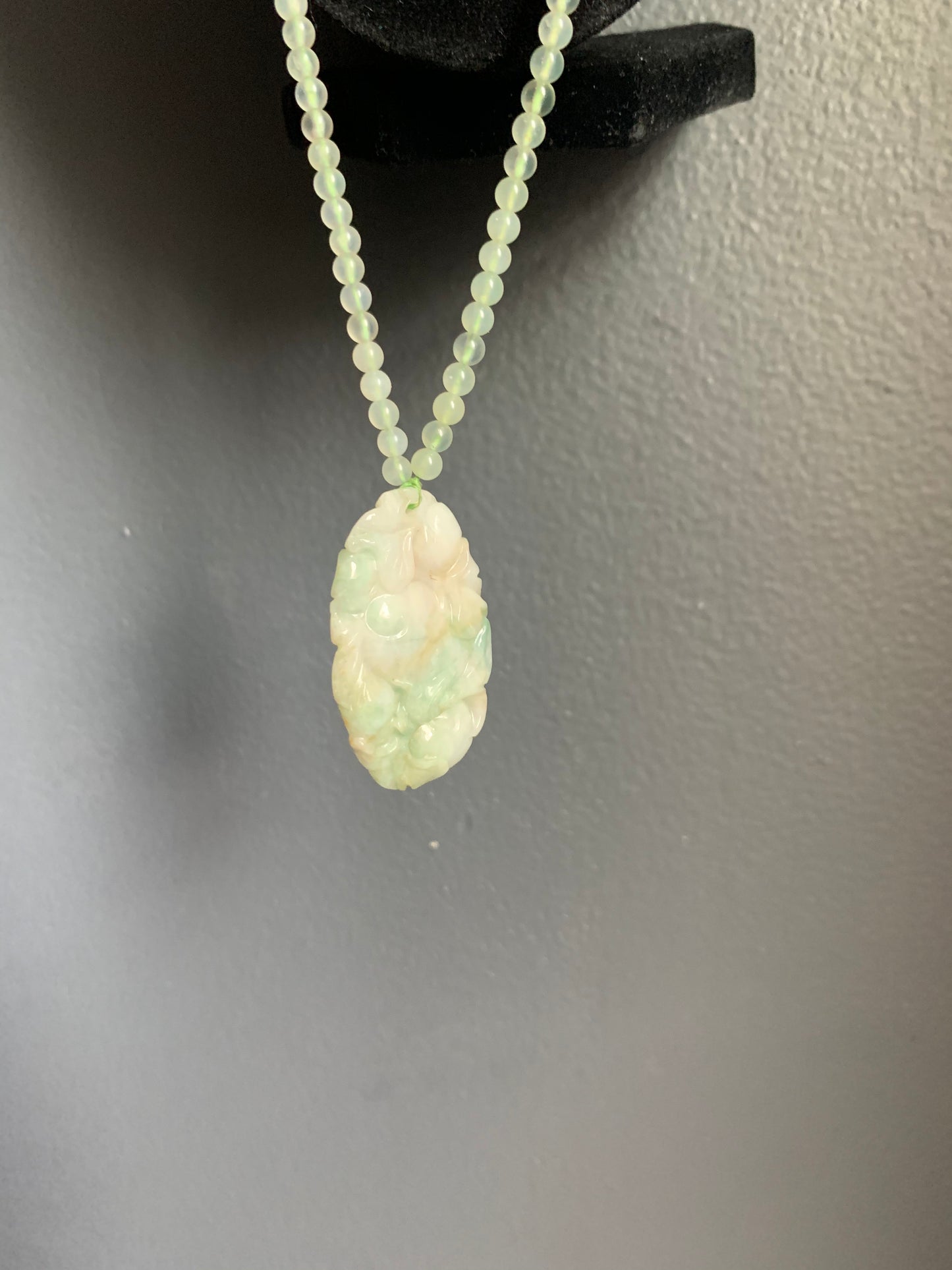 A jade necklace and pendant