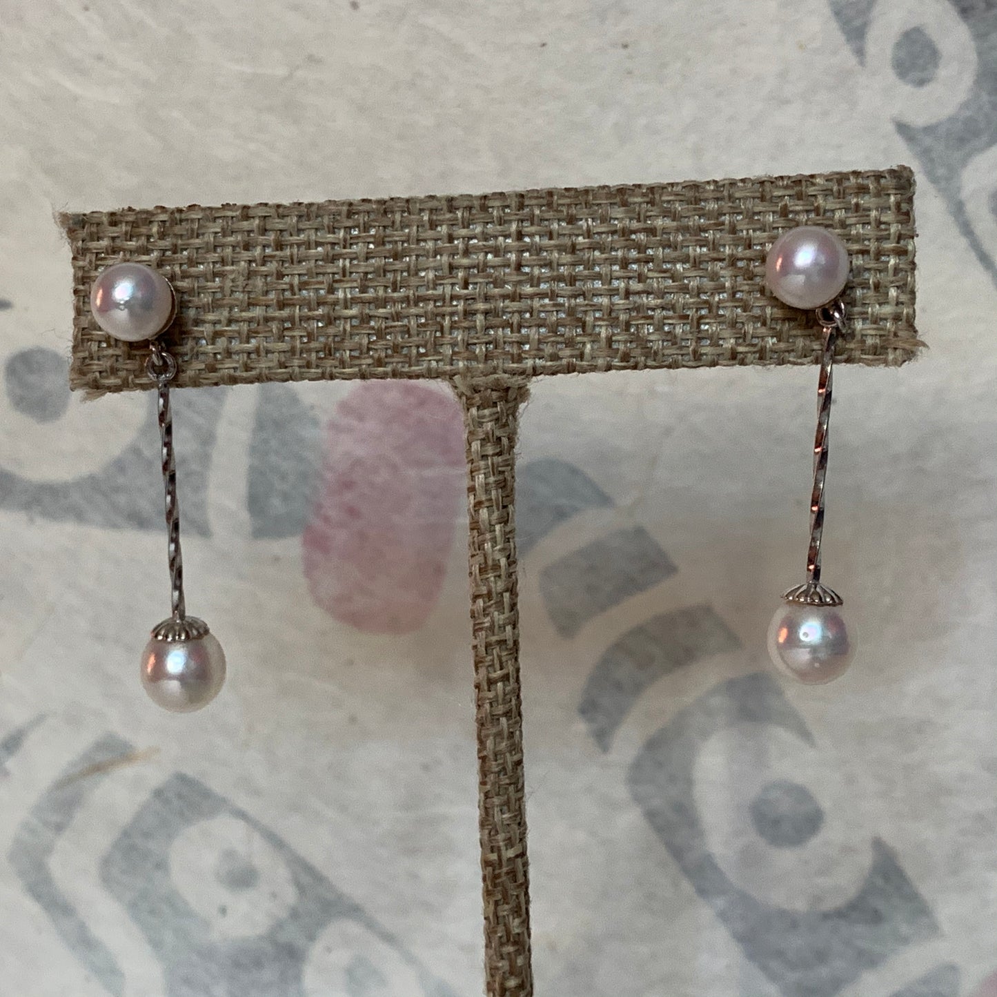 A pair of pearl dangling earrings