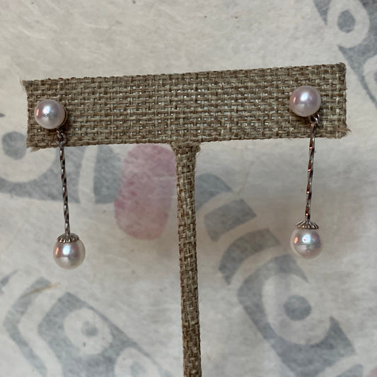 A pair of pearl dangling earrings