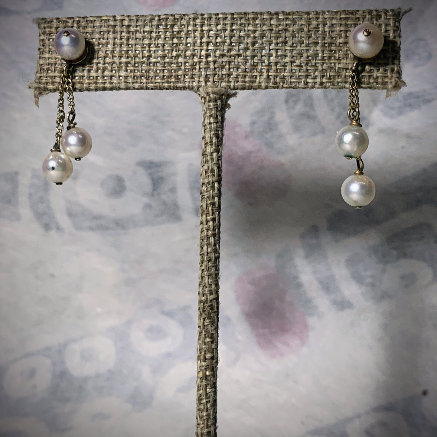 A pair of pearl and gold earrings