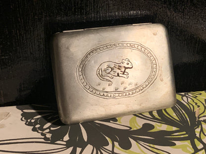 A silver box with hinged lid