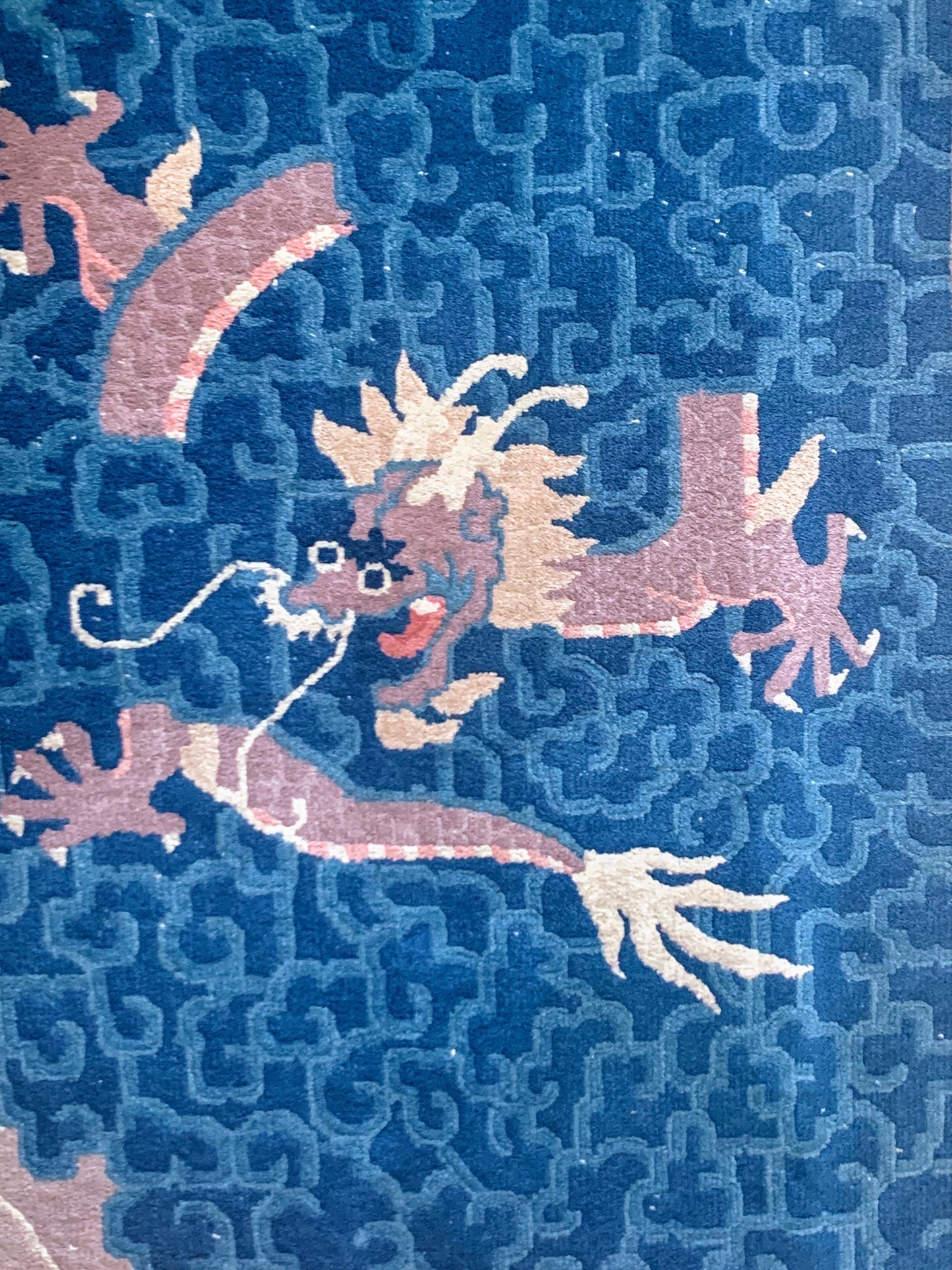 An antique Chinese dragon rug