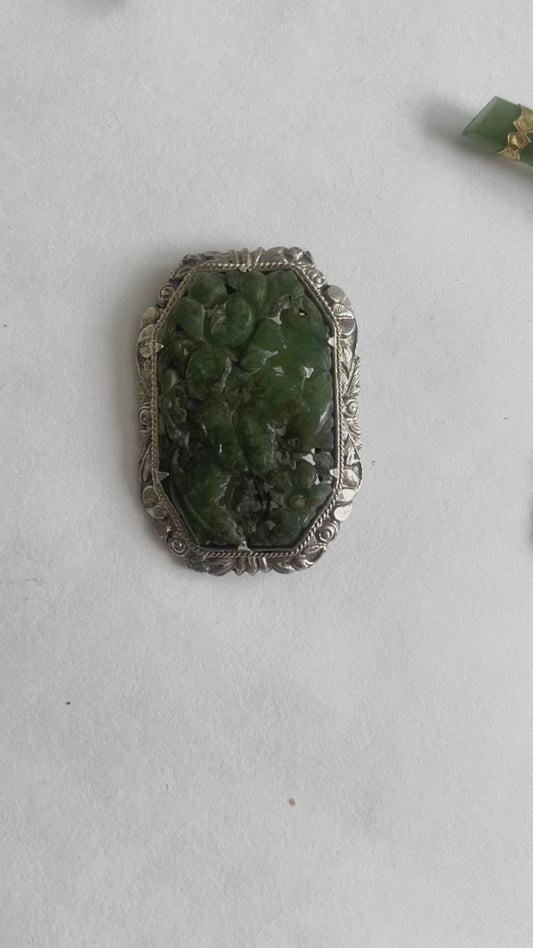 A vintage jade brooch In a gilded silver setting