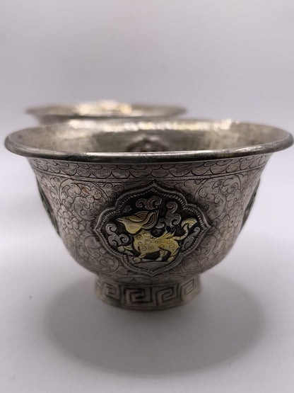 A pair of Tibetan silver cups