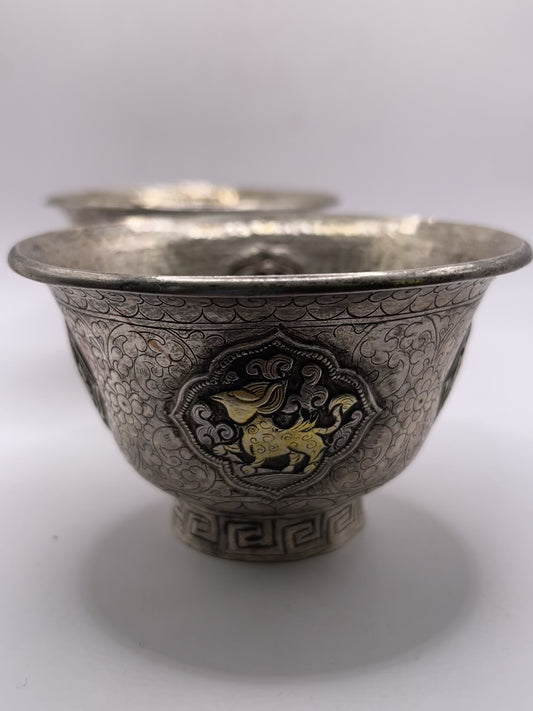 A pair of Tibetan silver cups