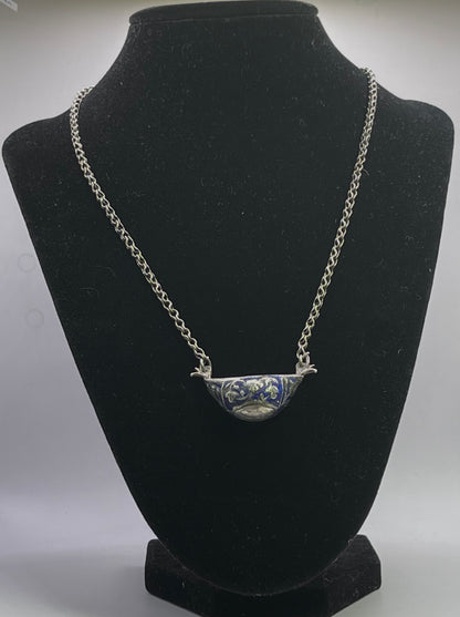 A vintage silver pendant and chain