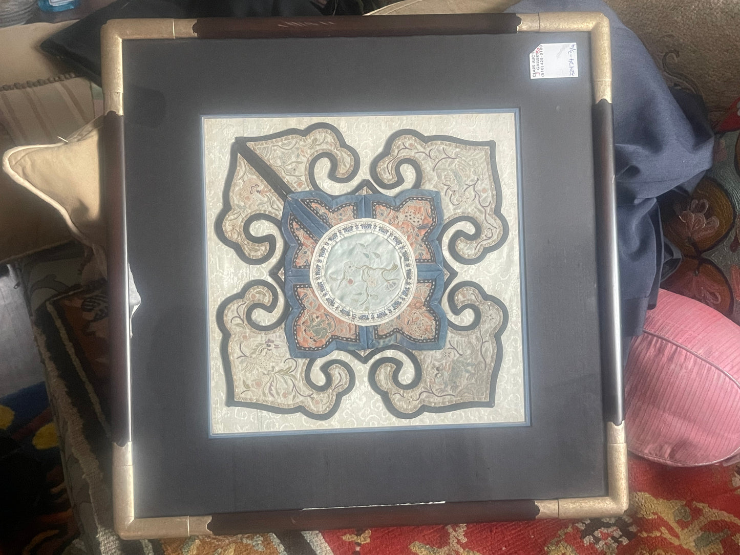 A framed embroidered antique collar