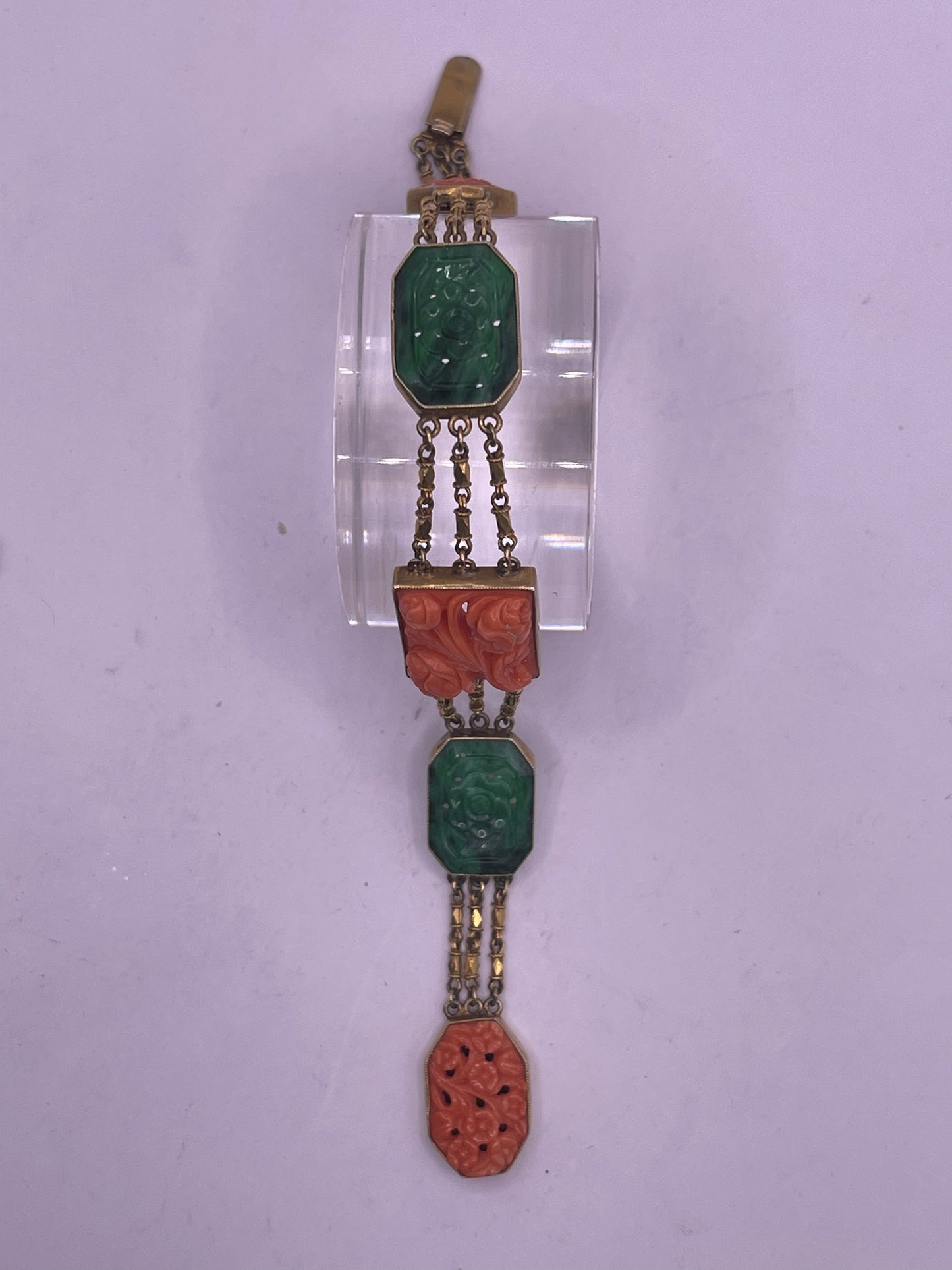 A jade and coral plaque in 14kt bracelet