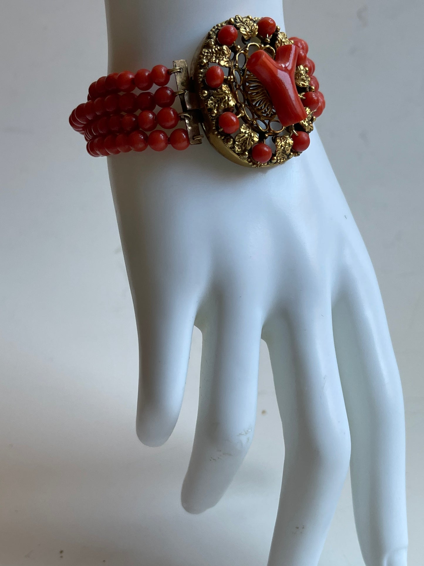 An antique coral bracelet with 4 strings of coral