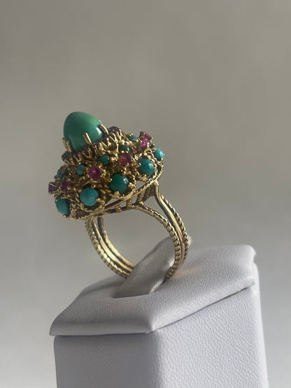 A vintage turquoise dome ring with rubies in a 14kt setting