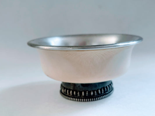 An antique Tibetan animal bone and silver tea cup