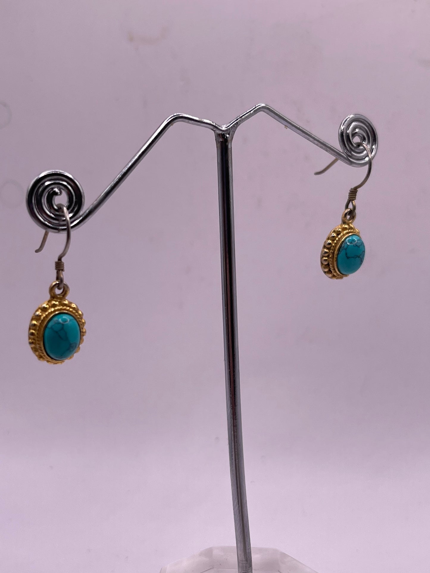 pair of turquoise earrings in 14kt settings
