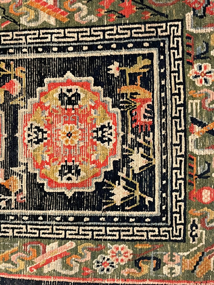 An antique Tibetan residential  rug with medallions