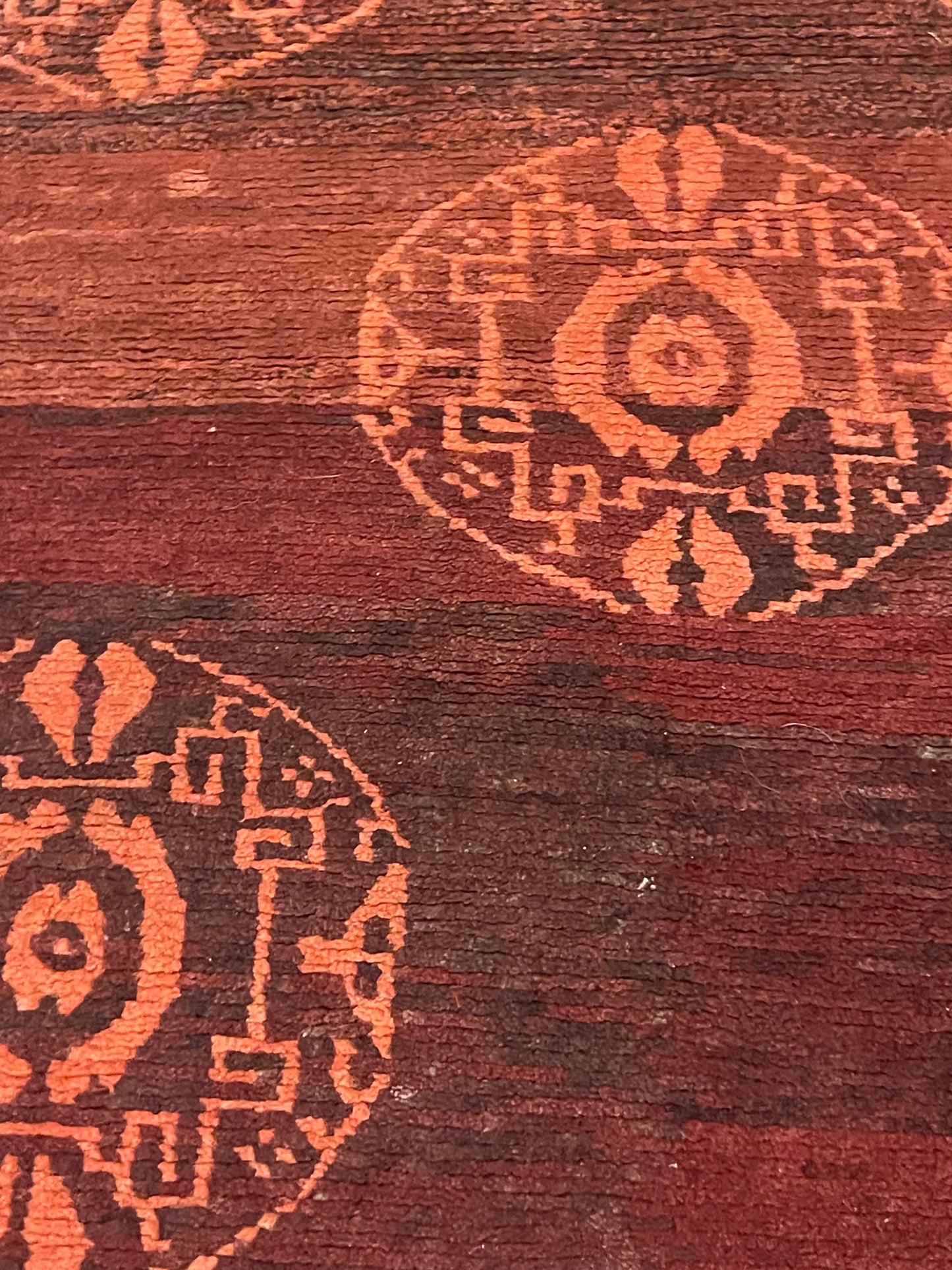 An antique Tibetan rug with coin motifs