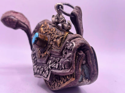 An antique Tibetan mechak purse with turquoise
