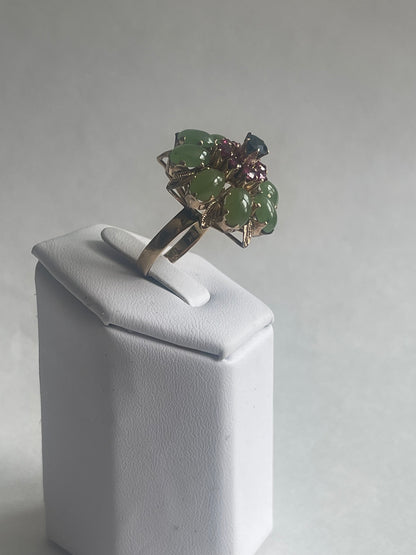 A vintage jade, ruby and sapphire cocktail ring