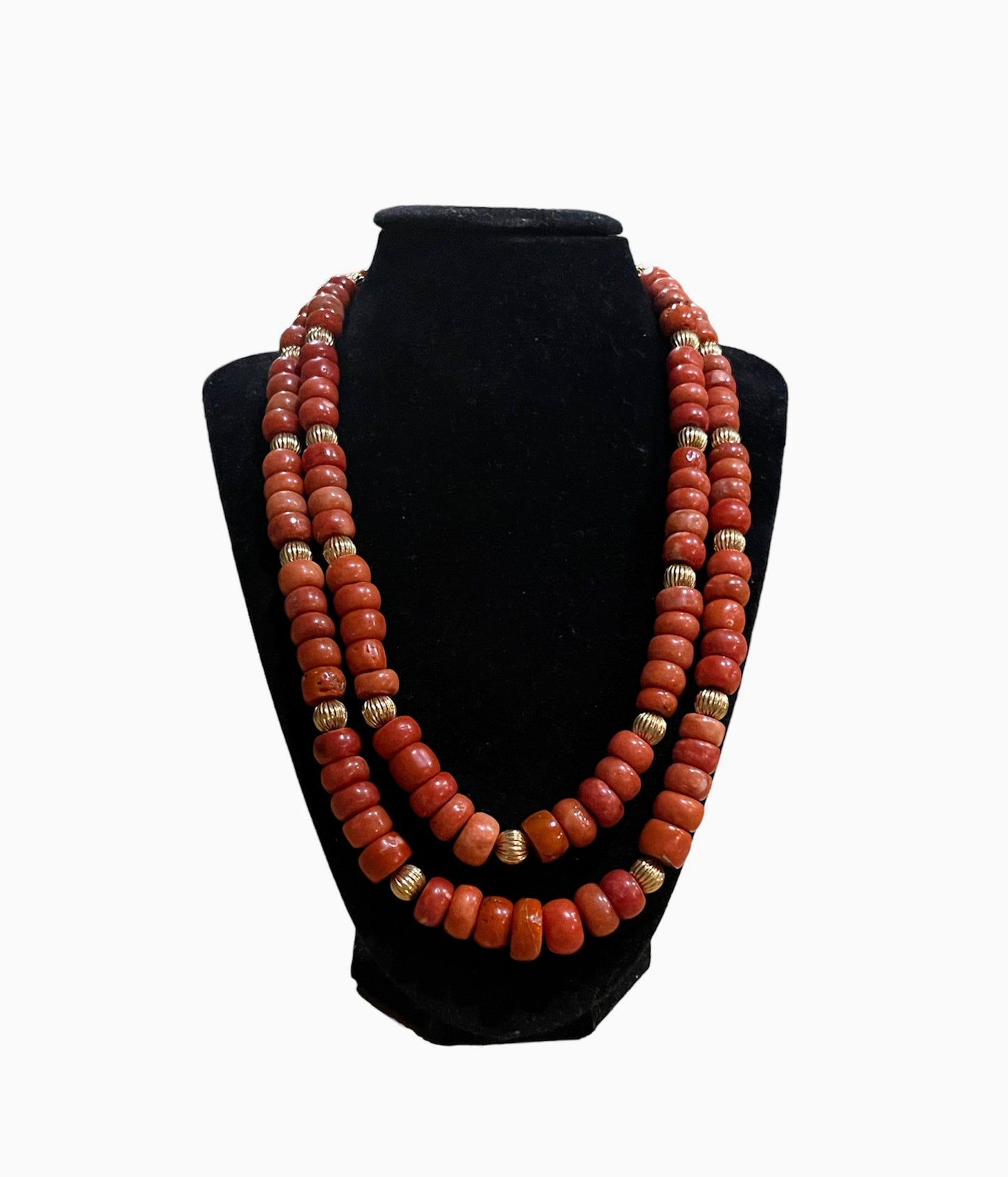 A coral and gold bead necklace