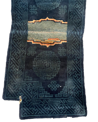 A vintage indigo Tibetan saddle rug