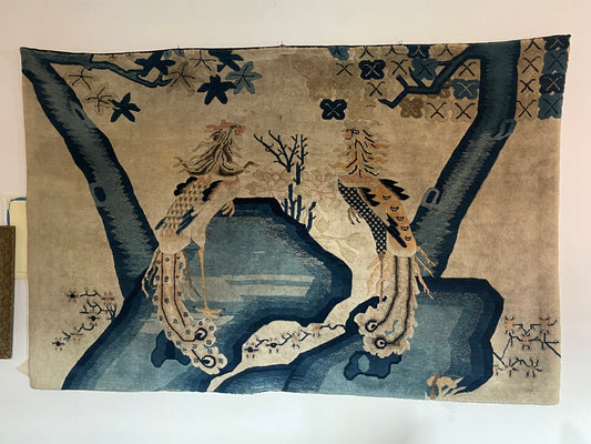 An antique Chinese pictorial rug