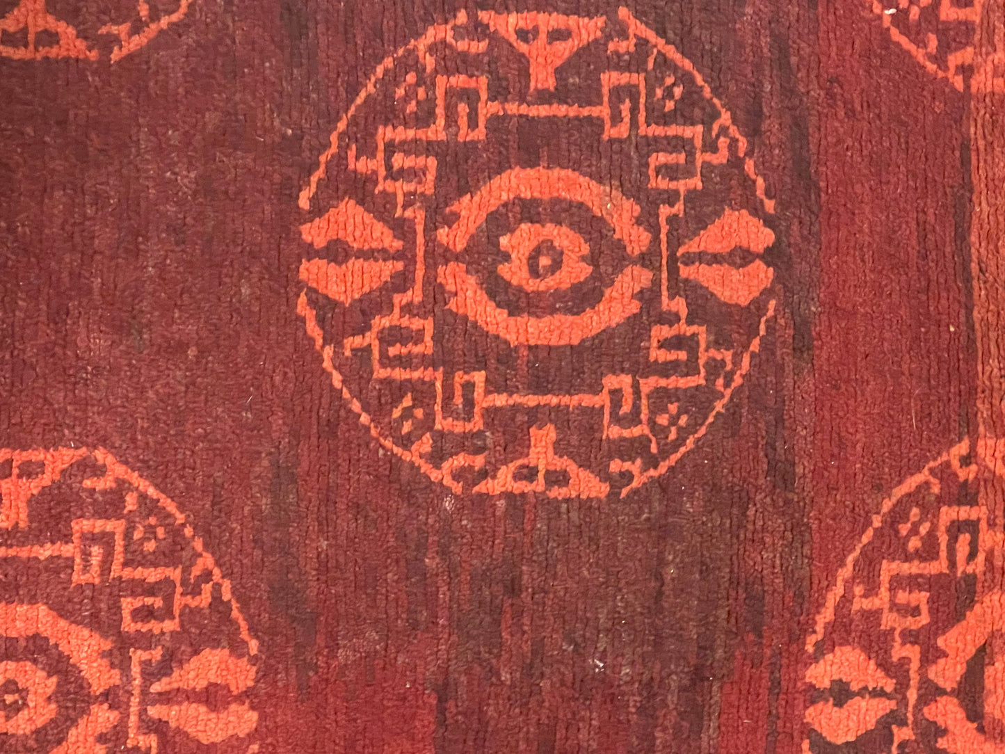 An antique Tibetan rug with coin motifs
