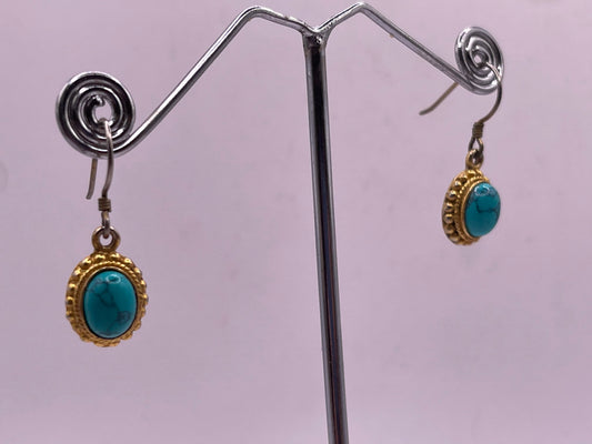 pair of turquoise earrings in 14kt settings