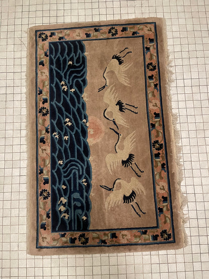 An antique Chinese pictorial rug