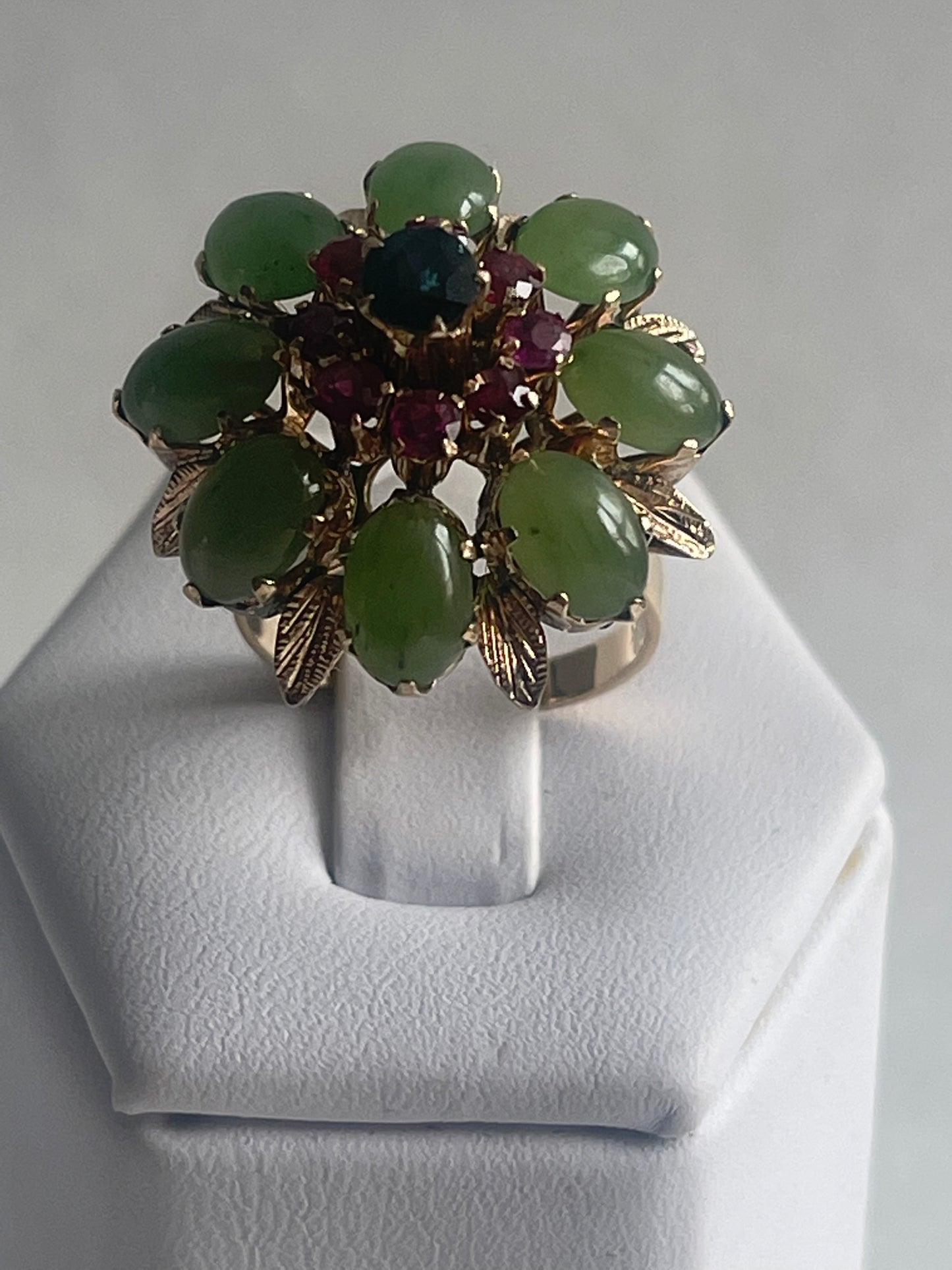 A vintage jade, ruby and sapphire cocktail ring