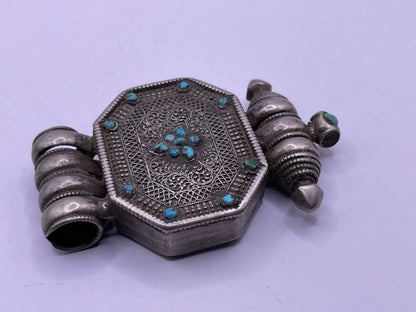 An antique 19th C., few Tibetan silver ghau with silver filigree and turquoise.