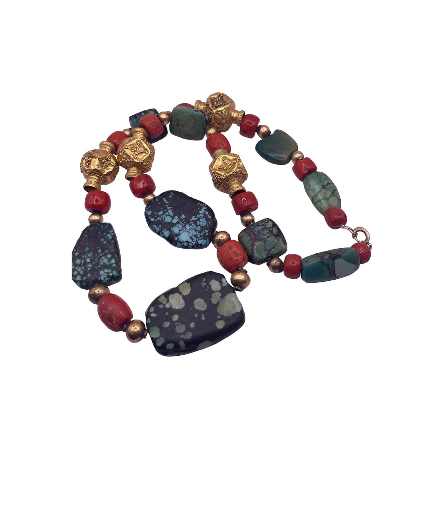 A necklace with antique Tibetan turquoise beads, coral beads and gold beads