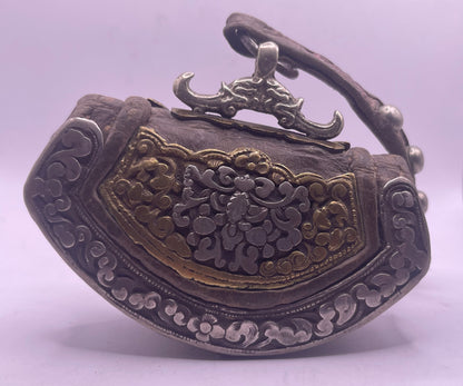 An antique Tibetan mechak purse with turquoise