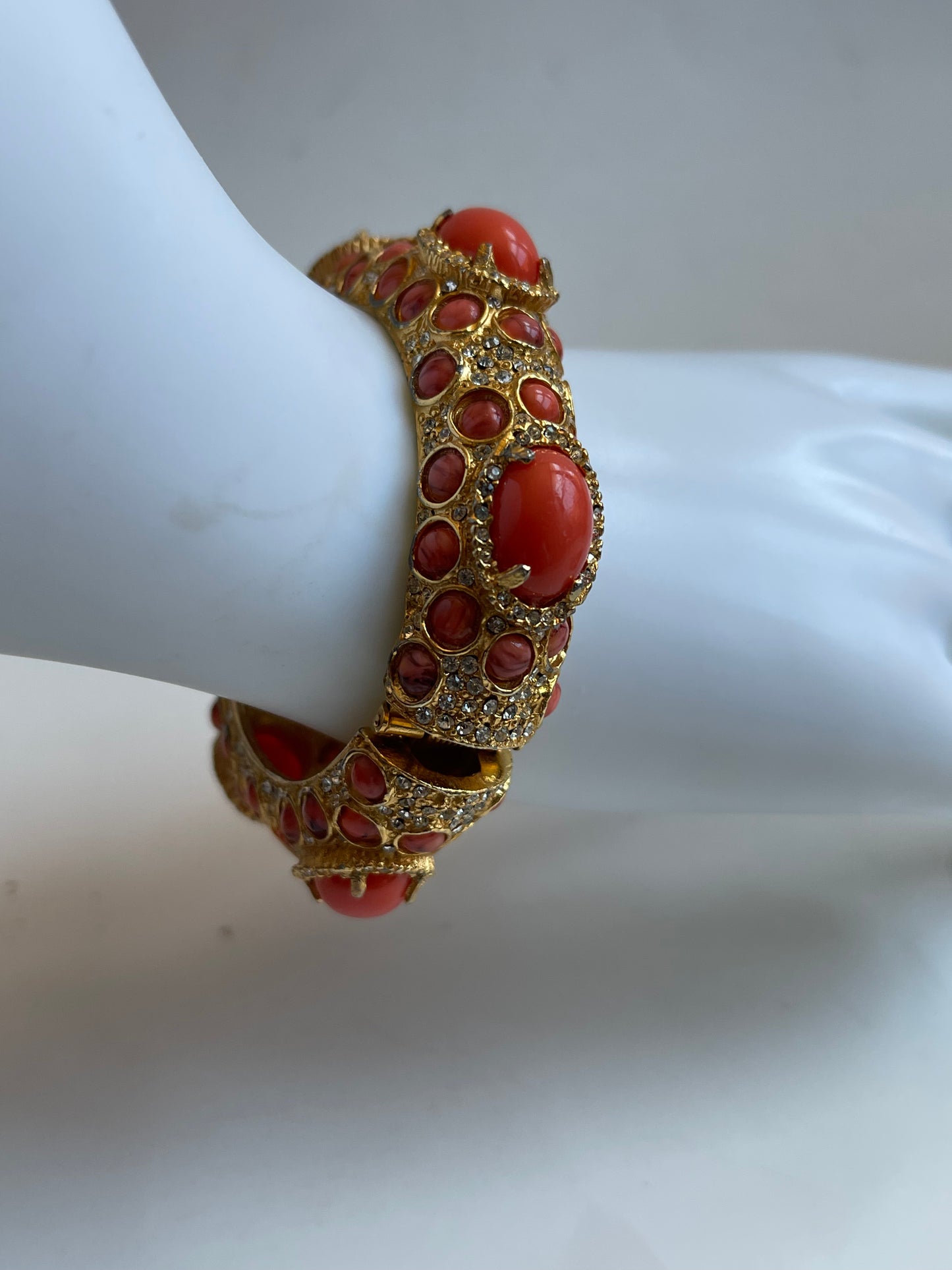 A vintage KJL coral like bracelet with rhinestones
