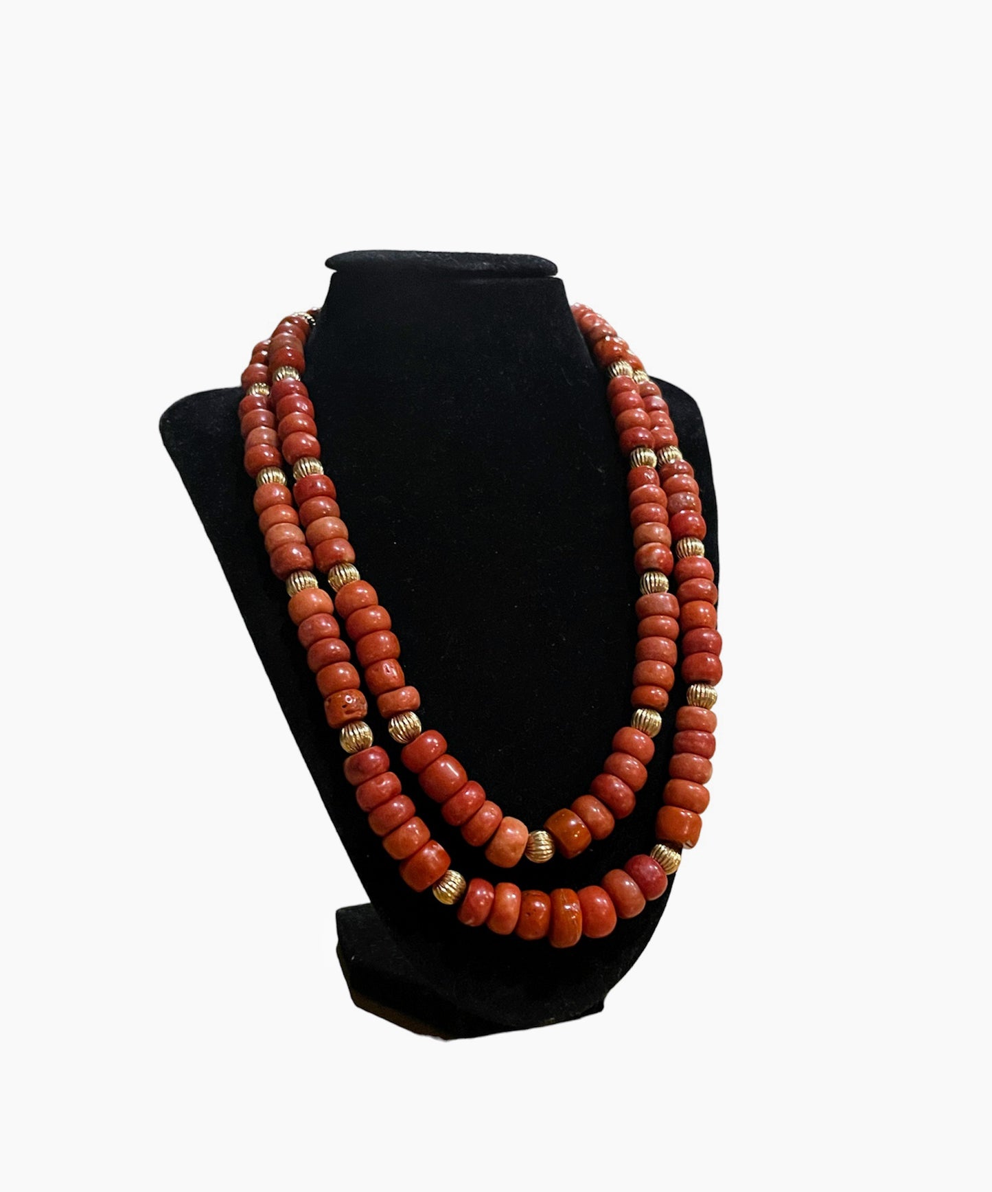 A coral and gold bead necklace