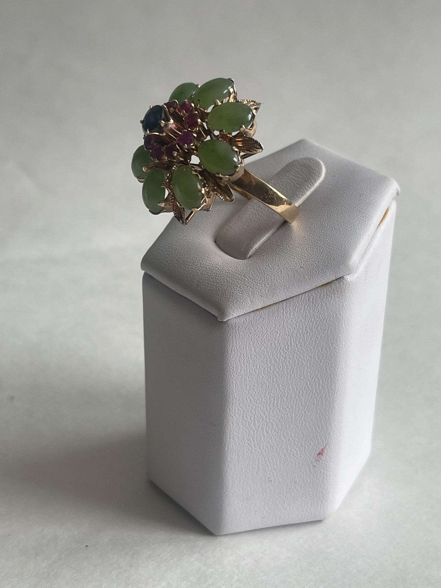 A vintage jade, ruby and sapphire cocktail ring