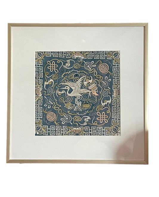 An antique framed Chinese embroidered textile fragment