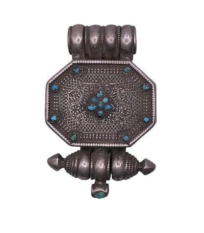 An antique 19th C., few Tibetan silver ghau with silver filigree and turquoise.