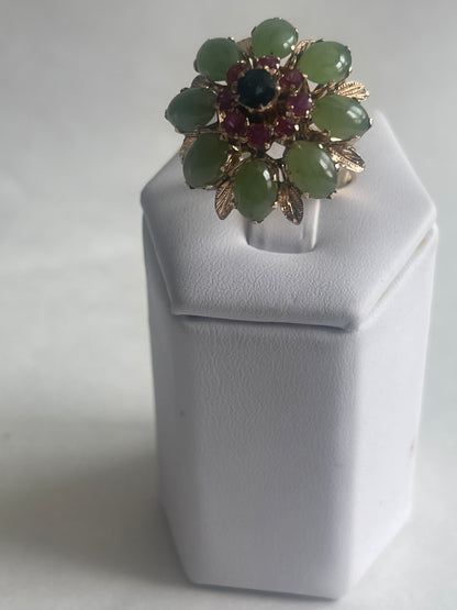 A vintage jade, ruby and sapphire cocktail ring