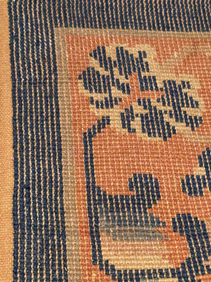 A mid 20th C. Peking rug with clouds and bats motifs