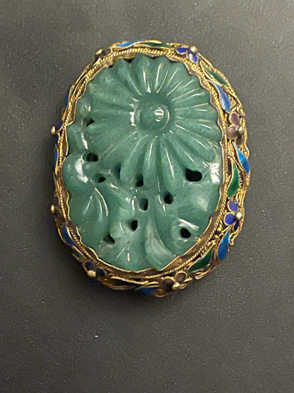 A vintage jade brooch in enameled gilt silver