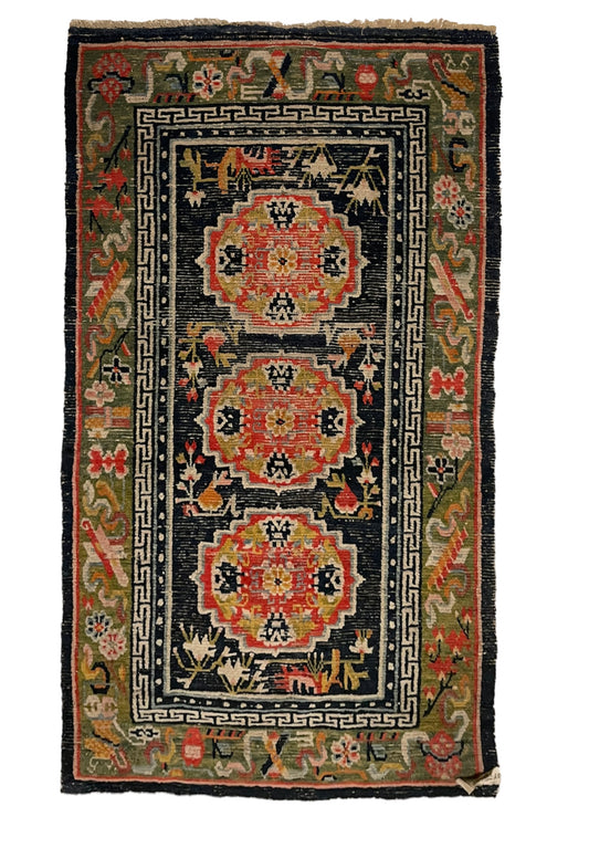 An antique Tibetan residential  rug with medallions