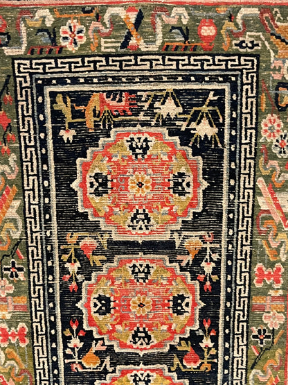 An antique Tibetan residential  rug with medallions