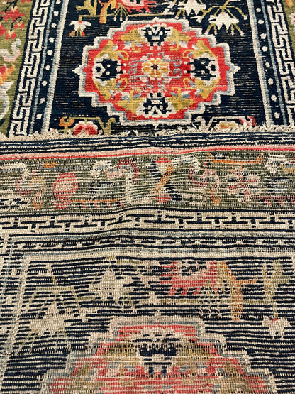 An antique Tibetan residential  rug with medallions