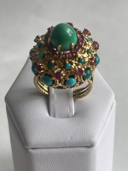 A vintage turquoise dome ring with rubies in a 14kt setting