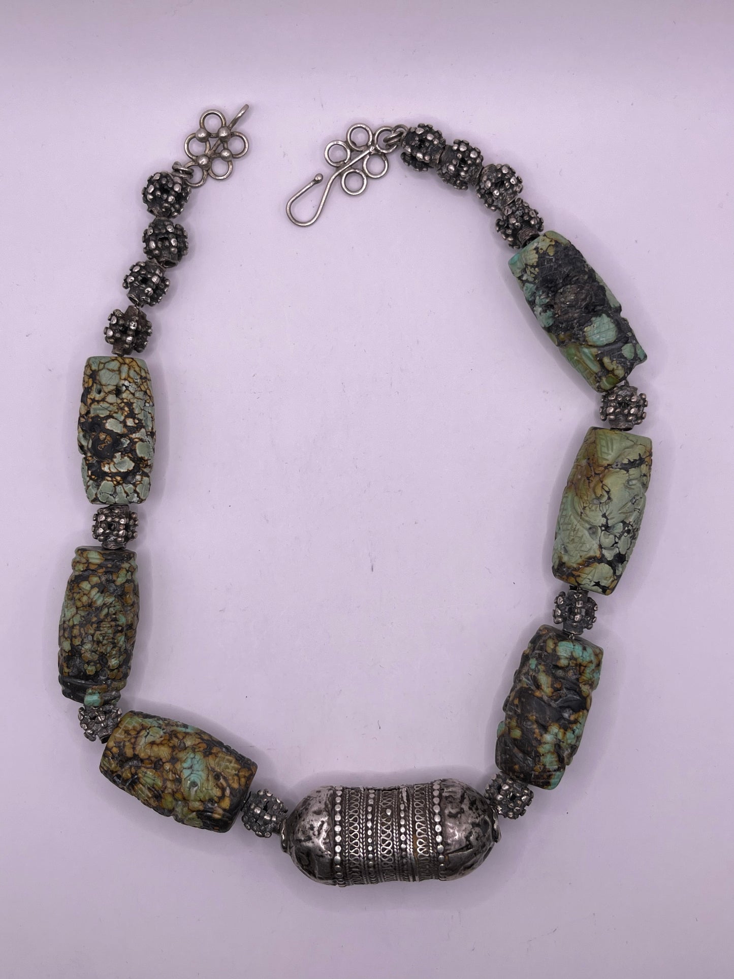 Vintage necklace with carved turquoise beads and antique silver beads